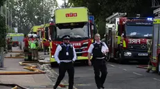 epa11565532 Firemen on the site of fire at a block of flats in Dagenham in east London, Britain, 26 August 2024. Four people were treated on scene by London Ambulance Service crews, and two taken to hospital after a fire at a block of flats on Freshwater Road in Dagenham, London Fire Commissioner Andy Roe said in a statement. More than 80 people were evacuated as 40 fire engines and around 225 firefighters tackled the fire, and a full investigation into the fire and its cause began, the statement added. EPA/ANDY RAIN