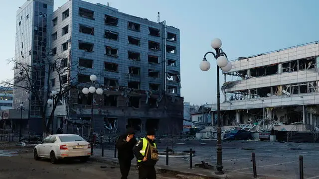 epa11889958 People walk at the site of a Russian missile strike in Kyiv, Ukraine, 12 February 2025, amid the Russian invasion. At least one man was killed and four others, including one child, were injured in a Russian attack involving missiles and shock drones in Kyiv, according to the State Emergency Service of Ukraine (SESU). EPA/SERGEY DOLZHENKO