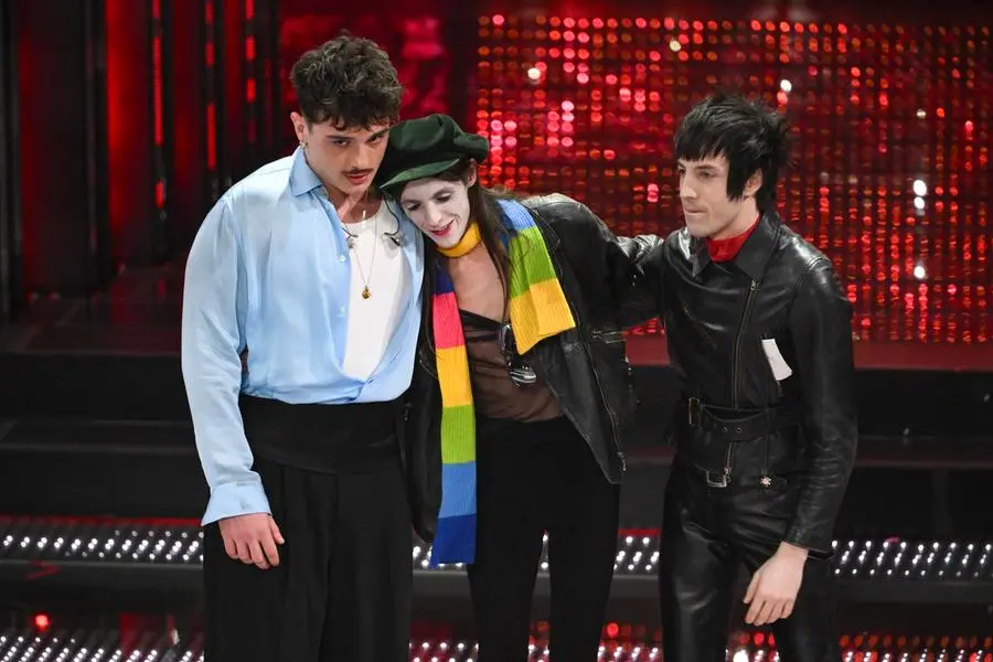 Italian singers Olly (L) and Lucio Corsi (C) on stage at the Ariston theatre during the 75th edition of the Sanremo Italian Song Festival, in Sanremo, Italy, 15 February 2025. The music festival will run from 11 to 15 February 2025. ANSA/ETTORE FERRARI