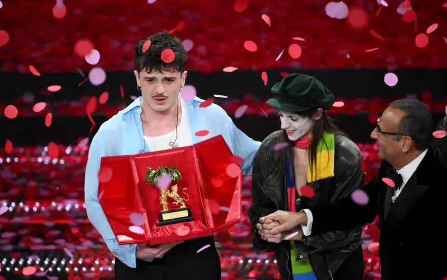 Italian singer Olly celebrates on stage after winning the 75th edition of the Sanremo Italian Song Festival with Italian singer Lucio Corsi and Sanremo Festival host and artistic director Carlo Conti in Sanremo, Italy, 15 February 2025. The music festival will run from 11 to 15 February 2025. ANSA/ETTORE FERRARI