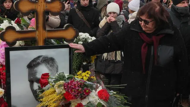 epa11900173 Russian opposition leader Alexei Navalny's mother Lyudmila (R) stands next to the grave of her son at the Borisovskoye cemetery in Moscow, Russia, 16 February 2025. Navalny died aged 47 in an arctic penal colony on 16 February 2024, after being transferred there in 2023. The colony is considered to be one of the world's harshest prisons. Alexei Navalny's body was laid to rest on 01 March 2024 at the Borisovskoye cemetery in Moscow. EPA/MAXIM SHIPENKOV