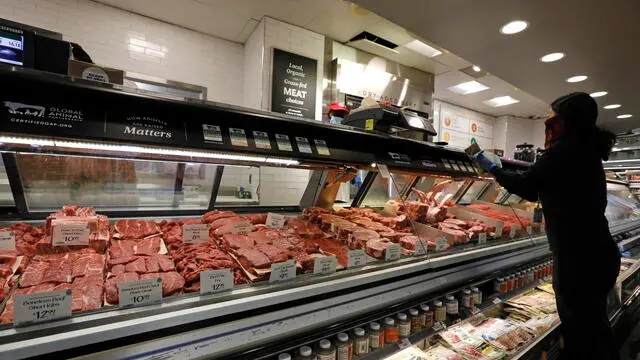 epa08408156 A shopper purchases meat at the Whole Foods Market at Columbus Circle in New York, New York, USA, 07 May 2020. The number of US workers filing for unemployment benefits last week marked a slow down from the peak but it is seven weeks of record applications since the pandemic. EPA/Peter Foley