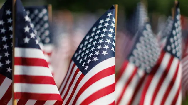 epa11361714 Some of the US flags planted on the Boston Common near the Soldiers and Sailors Monument in preparation for Memorial Day, in Boston, Massachusetts, USA, 22 May 2024. Hundreds of volunteers gathered to plant over 37,000 American flags, each a representation of a Massachusetts service member that had given their life since the Revolutionary War, which will remain on the Boston Common throughout the Memorial Day weekend. Memorial Day will be marked on May 27 in 2024. EPA/CJ GUNTHER