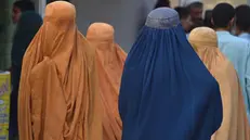 epa10952908 Women wearing burqas wait as Afghan refugees load their luggage on buses to depart for Afghanistan after the Pakistani government's deadline to expel undocumented immigrants passes, in Karachi, Pakistan, 01 November 2023. Pakistan is expected to implement its plan to expel undocumented immigrants as the deadline for them to leave the country expired. The move particularly affects the millions of Afghan refugees who had fled their homeland, many of them driven by decades of armed conflict and the return to power of the Taliban. Since the Pakistani authorities announced the 31 October deadline, a huge migratory flow has been recorded on the porous border between Pakistan and Afghanistan. According to official data, about 4.4 million Afghans are living in the country, of which 1.7 million are not registered. EPA/SHAHZAIB AKBER