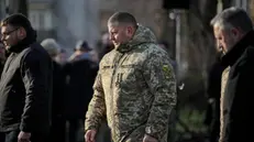 epa10993801 Valerii Zaluzhny (C), General Commander of Ukrainian armed forces, arrives to place a candle at the child statue titled 'Bitter Memory of Childhood' by Petro Drozdowsky at the Holodomor Genocide complex of the National Museum in Kyiv, Ukraine, 25 November 2023. The victims of the Holodomor, Ukrainian for 'Death by starvation,' are traditionally commemorated in Ukraine on the last Saturday of November. The Holodomor, or the Great Famine, in the former Soviet era Ukraine in 1932-1933 caused millions of Ukrainian lives. EPA/Oleg Petrasyuk