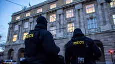 epa11040537 Police officers stand guard following a mass shooting at one building of the Charles University in central Prague, Czech Republic, 22 December 2023. According to the Czech Police President Martin Vondrasek, there are at least 14 people dead and 25 injured after the shooting at the Charles University on 21 December. According to Czech police the perpetrator was a 24 year-old Charles University student, who is also suspected of killing his father. EPA/MARTIN DIVISEK