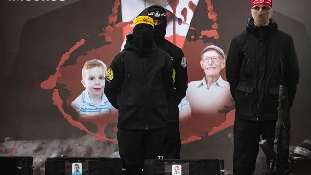 epa11909370 The coffins containing the bodies of Israeli hostages Ariel and Kfir Bibas sit on a stage before being handed over to the Red Cross by Hamas in Khan Yunis, southern Gaza Strip, 20 February 2025. Hamas was set to hand over the bodies of four Israeli captives, including that of youngest hostage Kfir Bibas, as part of the ongoing Gaza ceasefire deal. Hamas said in November 2023 that the two Bibas boys and their mother had been killed in an Israeli airstrike on Gaza. EPA/HAITHAM IMAD