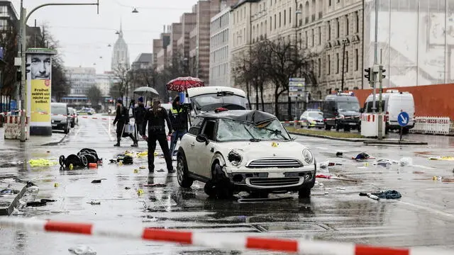 epa11893054 Police work at the scene after a vehicle was driven into a Ver.di demonstration in Munich, Germany, 13 February 2025. According to statements from Munich police, at least 28 people were injured, two of them seriously. The driver of the vehicle involved in the incident, a 24-year-old Afghan asylum seeker, has been arrested, police added. EPA/RONALD WITTEK