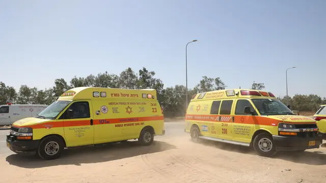 epa11319518 Ambulances arrive near the Kerem Shalom crossing, at the border with the Gaza Strip ,southern Israel, 05 May 2024. According to the Israel Defense Forces (IDF), approximately 10 projectile launches were identified crossing from the area adjacent to the Rafah Crossing toward the area of Kerem Shalom on 05 May. The Kerem Shalom crossing is currently closed to the passage of humanitarian aid trucks, the IDF added. EPA/ABIR SULTAN