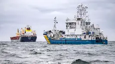 epa11856906 The Swedish Coast Guard vessel KBV033 (R) and the cargo ship Vezhen are anchored outside Karlskrona, Sweden, 27 January 2025, after a new cable break in the Baltic Sea. According to tracking sites, the Malta-registered ship Vezhen passed the area of the Latvian fiber cable that was damaged in the Swedish economic zone off Gotland on 26 January 2025. The Vezhen is under seizure while it is being investigated by Swedish authorities. EPA/JOHAN NILSSON SWEDEN OUT