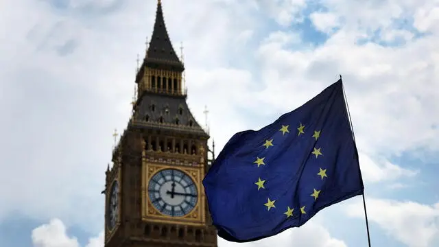 epa11493839 An EU flag flies outside the UK parliament in London, Britain, 24 July 2024. The new UK Labour Government is expected to review its relationship with EU after it promised improved relations with EU countries to reverse the harms of Brexit. EPA/ANDY RAIN