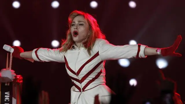 epa03353989 US singer Madonna performs on stage during her MDNA tour at St. Petersburg Sports and Concert Complex, in St. Petersburg, Russia, 09 August 2012 evening. The US State Department on Wednesday issued a warning for Americans planning to attend a Madonna concert in St Petersburg, saying the pop star's comments on the controversial trial of punk rock band Pussy Riot could place concertgoers in conflict with extremist members of the Russian Orthodox church, which has called for a boycott of her performances. EPA/ALEXANDER DEMIANCHUK / POOL