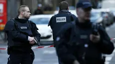 epa05091398 Police officers stand guard near a shooting scene after a man carrying a knife attempted to enter a Paris police station in the Goutte d'Or area, northern Paris, France, 07 January 2016. A man has been shot dead outside a Paris police station after apparently attacking the facility, amid fears that the incident might be an act of terrorism. Luc Poignant of the police union said the man allegedly shouted 'Allah is great' as he approached the facility. The incident comes on the one-year anniversary of an Islamist attack on the offices of satirical French newspaper Charlie Hebdo that prompted three days of terror and shootings in the city, ultimately resulting in 17 civilian deaths and the deaths of three Islamists as police closed in on them. EPA/IAN LANGSDON