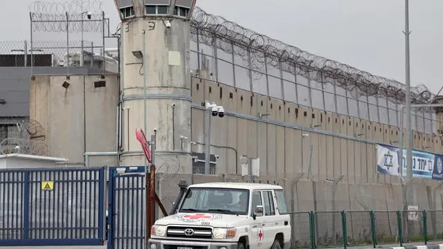 epa11914581 A vehicle of the International Committee of the Red Cross (ICRC) arrives to the West Bank military prison of Ofer to receive Palestinian prisoners as part of an Israel-Hamas ceasefire deal, north of Jerusalem, 22 February 2025. Israel and Hamas implemented the first phase of a hostage release and ceasefire deal on 19 January 2025. More than 48,000 Palestinians have been killed in the Gaza Strip, according to the Palestinian Ministry of Health, since Israel launched a military campaign in the strip in response to a cross-border attack led by the Palestinian militant group Hamas on 07 October 2023, in which about 1,200 Israelis were killed and more than 250 taken hostage. EPA/ATEF SAFADI