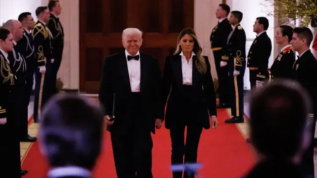 epa11917171 US President Donald Trump and First Lady Melania Trump arrive for the National Governors Association Dinner in the East Room of the White House, in Washington, DC, USA, 22 February 2025. EPA/SAMUEL CORUM / POOL