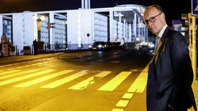 epa11919628 Chairman of Germany's Christian Democratic Union (CDU) Friedrich Merz leaves the TV studio after an election night TV talk show at the capital city studio of the TV channel ARD during the general elections in Berlin, Germany, 23 February 2025. EPA/RONALD WITTEK