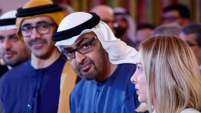 Italian Prime Minister Giorgia Meloni (R) flanked by United Arab Emirates' President Sheikh Mohamed bin Zayed Al Nahyan (C) during Italy - UAE business forum, Rome, 24 February 2025. ANSA/FABIO FRUSTACI