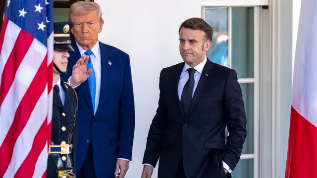 epa11921992 US President Donald J. Trump (L) greets French President Emmanuel Macron (R) as he arrives at the White House in Washington, DC, USA, 24 February 2025. EPA/SHAWN THEW
