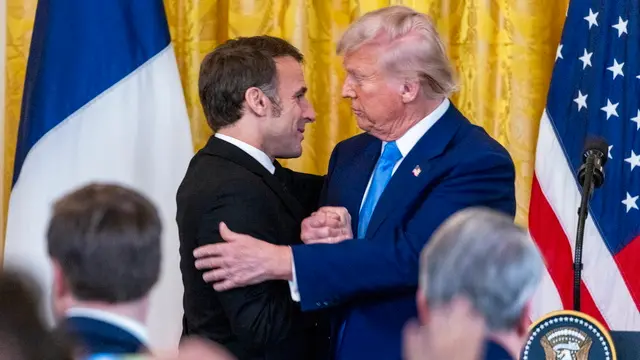 epaselect epa11922513 US President Donald Trump (R) and French President Emmanuel Macron (L) embrace at the end of a joint press conference in the East Room to the White House in Washington, DC, USA, 24 February 2025. EPA/SHAWN THEW