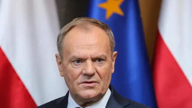 epa11902582 Polish Prime Minister Donald Tusk speaks to the media at a press briefing at Okecie airport in Warsaw, Poland, 17 February 2025. Tusk departs to Paris, where he will attend an informal meeting on the situation in Ukraine and security in Europe. EPA/PAWEL SUPERNAK POLAND OUT