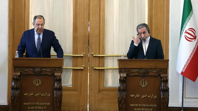 epa11923528 Iranian Foreign Minister Abbas Araghchi (R) and his Russian counterpart Sergey Lavrov hold a joint press conference in Tehran, Iran, 25 February 2025. Lavrov is visiting Tehran to hold talks with Iranian senior officials. EPA/ABEDIN TAHERKENAREH