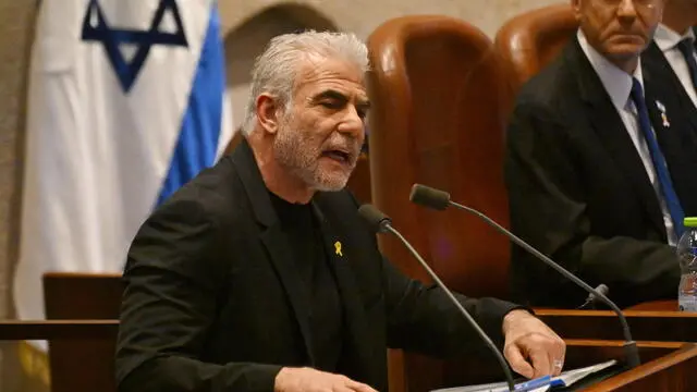 epa11689140 Opposition leader Yair Lapid, of the Yesh Atid party, speaks at the opening of the 25th Knesset session in Jerusalem, 28 October 2024. Israel opened its Knesset session marking the anniversary of the 'Swords of Iron' war, Israel's ground operations in the Gaza Strip. More than 43,000 Palestinians and over 1,400 Israelis have been killed, according to the Palestinian Health Ministry and the Israel Defense Forces (IDF), since Hamas militants launched an attack against Israel from the Gaza Strip on 07 October 2023, and the Israeli operations in Gaza and the West Bank which followed it. EPA/DEBBIE HILL / POOL