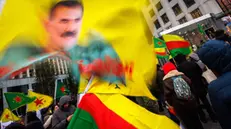 epa11770330 Kurds wave flags and pictures of Kurdistan Workers' Party leader Abdullah Ocalan during a protest called by the Democratic Council of Kurdistan Communities in Belgium (NAV-BEL), near the European Parliament in Brussels, Belgium, 11 December 2024. NAV-BEL called for the protest against the role of Turkey in Syria and to highlight the need for protecting the Kurds in that country, following the overthrow of president Bashar al-Assad. EPA/OLIVIER MATTHYS