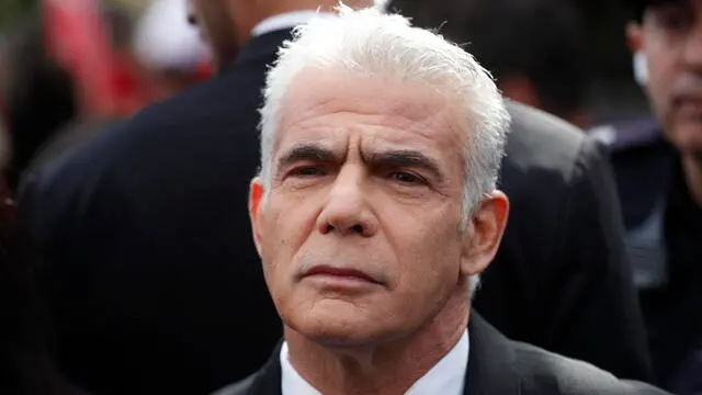 epa10464944 Former Israeli PM Yair Lapid prior to his address to protesters during an anti-government rally next to the Israeli parliament in Jerusalem, 13 February 2023. Israeli activists are protesting against the newly-formed government of Prime Minister Benjamin Netanyahu amid reports of government's intention to reform judicial system which critics say would weaken the power of the Israeli Supreme Court. EPA/ATEF SAFADI