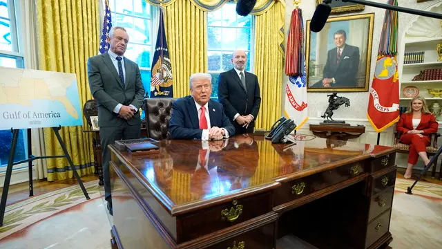 epa11924662 US President Donald Trump (C) speaks to reporters alongside Health and Human Services Secretary Robert F. Kennedy Jr. (L), Secretary of Commerce Howard Lutnick (2-R), and White House Press Secretary Karoline Leavitt (R) as he signed executive orders in the Oval Office of the White House in Washington, DC, USA, 25 February 2025. EPA/YURI GRIPAS / POOL