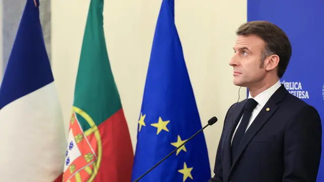 epa11930086 French President Emmanuel Macron attends a press conference after signing bilateral agreements with Portuguese Prime Minister Luis Montenegro (not seen) at the city hall in Porto, Portugal, 28 February 2025. EPA/JOSE COELHO