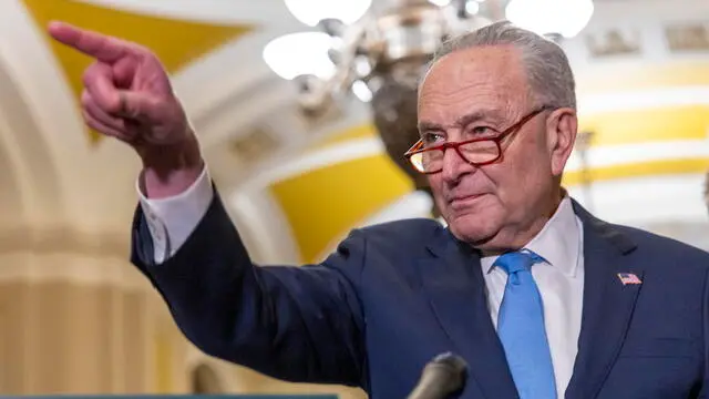 epa11908417 Senate Minority Leader Chuck Schumer responds to a question from the news media during a post Democratic Caucus luncheon press conference in the US Capitol in Washington, DC, USA 19 February 2025. US President Donald J. Trump has endorsed the House option of one budget reconciliation bill leaving the Senate Republicans to reconsider their schedule of votes this week. EPA/SHAWN THEW