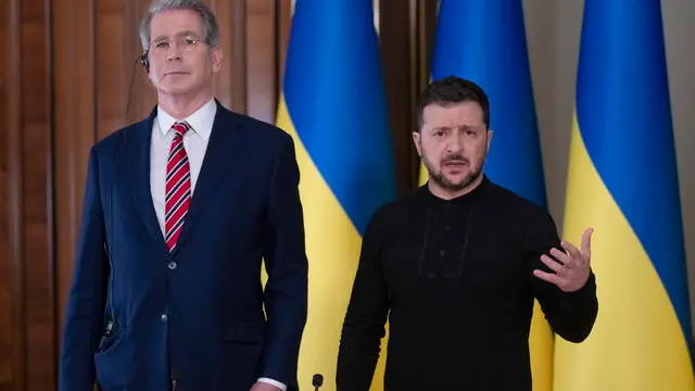 epa11891356 Ukrainian President Volodymyr Zelensky (R) speaks to the press during his meeting with US Treasury Secretary Scott Bessent (L) in Kyiv, Ukraine, 12 February 2025. EPA/STRINGER