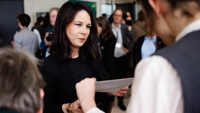 epa11923766 German Foreign Minister Annalena Baerbock of the Green Party (Die Gruenen) Annalena Baerbock receives her documents as a parliamentarian before a parliamentary group meeting at the German parliament, Bundestag, in Berlin, Germany, 25 February 2025. Germany held early federal elections on 23 February. EPA/CLEMENS BILAN