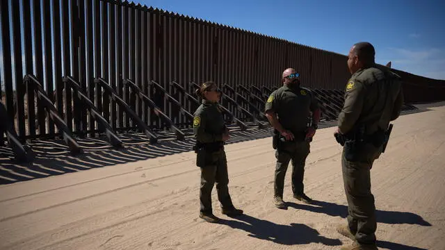 epa11929056 US Border Patrol agents discuss activity at the floating US border wall in Imperial County, California, USA, 27 February, 2025. With US President Donald trump signing multiple executive actions to overhaul parts of the US immigration system, including how migrants are processed and deported from the US, the US southern border with Mexico has seen a massive slow down in migrants trying to cross over. EPA/ALLISON DINNER