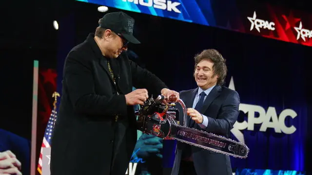 epaselect epa11911578 Argentine President Javier Milei (R) hands US entrepreneur and US special government employee Elon Musk a chainsaw at the Conservative Political Action Conference (CPAC) 2025 at National Harbor, Maryland, USA, 20 February 2025. The Conservative Political Action Conference is an annual political conference attended by conservative activists and elected officials from across the United States and beyond. EPA/WILL OLIVER / POOL