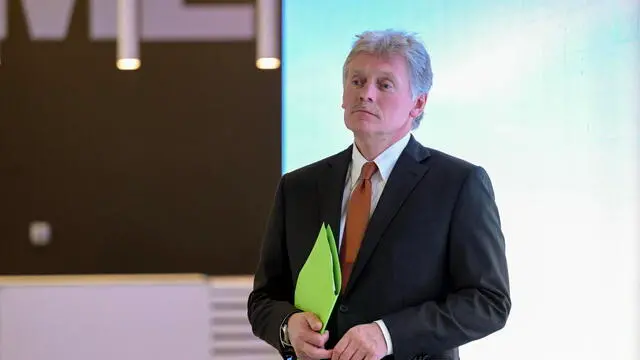 epa11770852 Russian Presidential Press Secretary Dmitry Peskov tours an exhibition on AI developments as part of the AI Journey 2024, at the Sberbank City business complex, in Moscow, Russia, 11 December 2024. The AI Journey 2024, an annual international conference on artificial intelligence and machine learning, runs from 11 to 13 December 2024 in Moscow. EPA/ALEXEI NIKOLSKY/SPUTNIK/KREMLIN POOL MANDATORY CREDIT