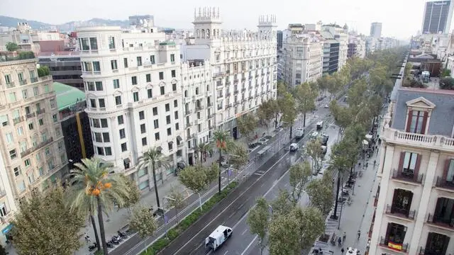 epa06272950 The Diagonal street in Barcelona is closed to traffic as municipal cleaning workers clear the road from candle wax from the protest vigil held the previous night in Barcelona, Spain, 18 October 2017. The protest was called against the imprisonment of leaders of pro-independence organizations Catalonian National Assembly, Jordi Sanchez, and Omnium Cultural, Jordi Cuixart. National Court magistrate Carmen Lamela sent to prison to Sanchez and Cuixart for a sedition offense, 16 October 2017. EPA/MARTA PEREZ