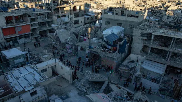 epa11931180 Palestinians hang decorations next to their destroyed homes in preparation for the holy month of Ramadan in Khan Yunis, southern Gaza Strip, 28 February 2025. The first day of Ramadan, the ninth month in the Islamic calendar, is expected to fall on 01 or 02 March 2025, depending on the sighting of the crescent moon. Muslims around the world observe the holy month of Ramadan by praying at night and abstaining from food and drink between sunrise and sunset. Ramadan is the ninth month in the Islamic calendar, and the first verse of the Quran is believed to have been revealed during the last 10 nights. EPA/HAITHAM IMAD