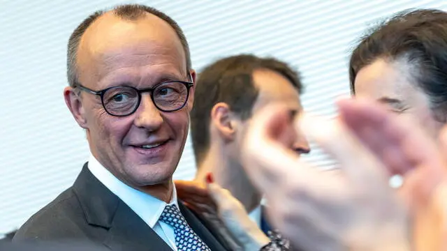 epa11923841 Chairman of the Christian Democratic Union (CDU) party and faction Friedrich Merz (L) attends a CDU/CSU parliamentary group meeting at the German parliament, Bundestag, in Berlin, Germany, 25 February 2025. Germany held early federal elections on 23 February 2025. EPA/ANDREAS GORA / POOL
