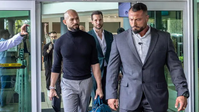 epa11928432 Former professional kickboxer and social media influencer Andrew Tate (L) and his brother Tristan (C, back) arrive at Fort Lauderdale Airport in Fort Lauderdale, Florida, USA, 27 February 2025. The Tate brothers were arrested in 2022 in Romania on charges of human trafficking and intention to form an organized crime group. The brothers landed in the US on 27 February after Romanian prosecutors agreed to let them leave. EPA/CRISTOBAL HERRERA-ULASHKEVICH