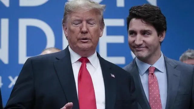 epa08044295 US President Donald Trump (L) and Canada's Prime minister Justin Trudeau (R) during NATO Summit in London, Britain, 04 December 2019. NATO countries' heads of states and governments gather in London for a two-day meeting. EPA/OLIVIER HOSLET