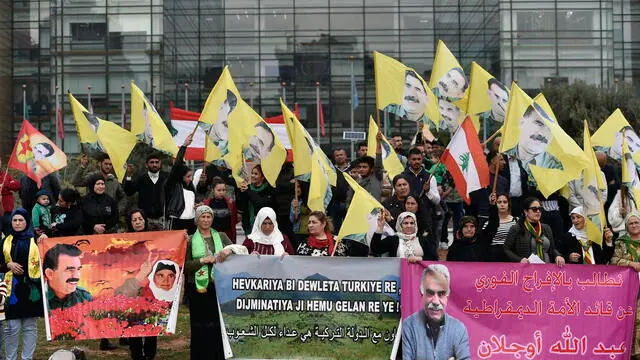 epa11147351 Supporters of Kurdistan Workers' Party (PKK) living in Lebanon carry banners, placards, national flags and pictures of PKK leader Abdullah Ocalan as they shout slogans on the 25th anniversary of his arrest, outside the United Nations Economic and Social Commission for Western Asia (UN-ESCWA) headquarters in Beirut, Lebanon, 12 February 2024. Tens of supporters of the PKK gather to demand the release of Abdullah Ocalan the jailed Kurdish leader of the Kurdistan Workers Party (PKK). EPA/WAEL HAMZEH