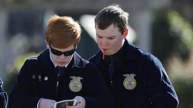 epa11815743 Students of the FFA, Future Farmers of America, wait of the passing of the casket of former US President Jimmy Carter en-route to Maranatha Baptist Church for a private service during the final day of his state funeral in his hometown of Plains, Georgia, USA, 09 January 2025. Carter, the 39th US president, died at age 100, 29 December 2024. EPA/ERIK S. LESSER `