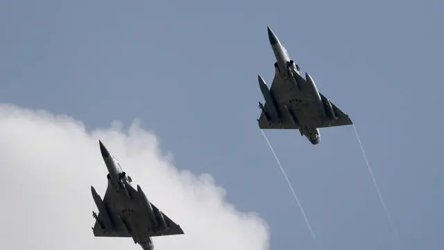 epa10109621 Two Taiwanese Air Force Mirage 2000-5 fighter jets fly by an airbase in Hsinchu, Taiwan, 07 August 2022. Following a visit of US House of Representatives Speaker Pelosi to Taiwan, the Chinese military started to hold a series of live-fire drills in six maritime areas around Taiwan's main islan from 04 to 07 August 2022. EPA/RITCHIE B. TONGO