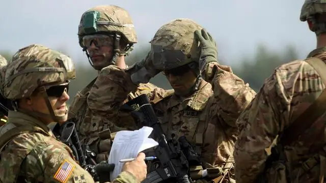 epa05536792 US Paratroopers assigned to Company B, 2nd Battalion, 503rd Infantry Regiment (Airborne), 173rd Airborne Brigade hold a briefing after a jump within the 'Bayonet Strike' airborne maneuvers in Adazi, Latvia, 12 September 2016. The 173rd Airborne Brigade, based in Vicenza, Italy, is the Army Contingency Response Force in Europe, and is capable of projecting forces to conduct full of range of military operations across the United States European, Central and Africa Commands areas of responsibility within 18 hours. Operation Atlantic Resolve is U.S. led effort in Eastern Europe that demonstrates US commitment to the collective security of NATO and dedication to enduring peace and stability in the region, a press release fom the Defence Video Imagery Distribution System (DVIDS) said. EPA/VALDA KALNINA