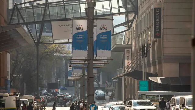 epa10809138 Banners in a street as final preparations are underway for the 15th BRICS Summit at the Sandton Convention Centre, Johannesburg, South Africa, 20 August 2023. South Africa is hosting the 15th BRICS Summit starting 22 August, where emerging economies of Brazil, Russia, India, South Africa and China will get together. The Russian president will not attend the summit. EPA/KIM LUDBROOK