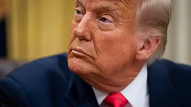 epa11945823 US President Donald Trump prior to signing an executive order in the Oval Office of the White House in Washington, DC, US, 06 March 2025. Trump signed executive orders to pause tariffs on USMCA trade from Canada and Mexico until 02 April 2025. EPA/AL DRAGO / POOL