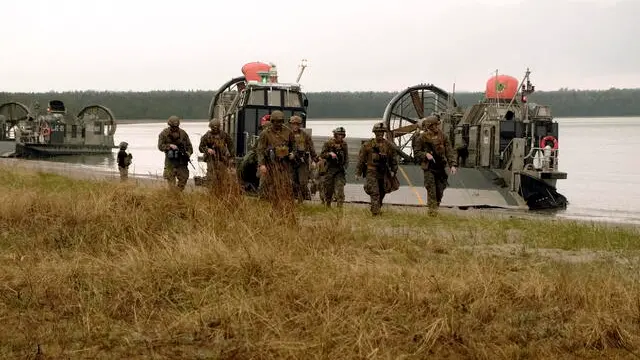 epa09959590 US Marines attend a landing training during the Hedgehog 22 military exercise in Saaremaa, Estonia, 20 May 2022. Members of Task Force 61 Naval Amphibious Forces Europe / 2d Marine Division (TF-61/2), operating under US Sixth Fleet, joined their Estonian counterparts to kick off the exercise. Hedgehog is one of the biggest-ever Nato exercises in the Baltics. This year it takes place from 16 May to 03 June. The drills involve all branches of the armed forces, and consist of air, sea, land and cyber training. EPA/VALDA KALNINA