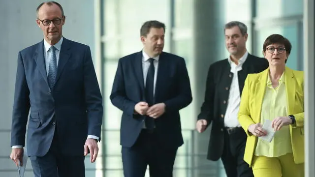 epa11949127 (L-R) Chairman of the Christian Democratic Union (CDU) party and faction Friedrich Merz, Social Democratic Party (SPD) co-chairman Lars Klingbeil, State Premier of Bavaria Markus Soeder, and Social Democratic Party (SPD) co-chairwoman Saskia Esken arrive for a press conference during ongoing exploratory talks on the premises of the German parliament, the Bundestag, in Berlin, Germany, 08 March 2025. Germany's Christian Democratic Union (CDU) and Social Democratic Party (SPD) continue exploratory talks on forming a potential governing coalition. EPA/CLEMENS BILAN