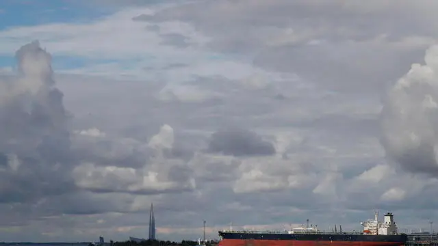 epa10195292 An oil tanker is seen by the Lakhta Centre business tower (L), the headquarters of Russian energy corporation Gazprom, in St. Petersburg, Russia, 20 September 2022. EPA/ANATOLY MALTSEV